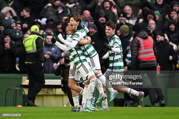 Kyogo Furuhashi of Celtic celebrates with teammates after scoring their team's second goal during the Cinch Scottish Premiership match between Celtic...