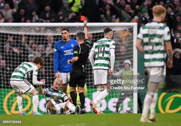 Leon Balogun of Rangers is being shown a red card by Referee Nick Walsh during the Cinch Scottish Premiership match between Celtic FC and Rangers FC...