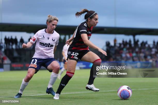 Melissa Caceres of the Wanderers is put under pressure by Elise Kellond-Knight of the Victory during the A-League Women round 10 match between...