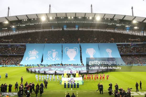 The Emirates FA Cup, English Premier League, UEFA Champions League, UEFA Super Cup and FIFA Club World Cup trophies are displayed as both sides enter...