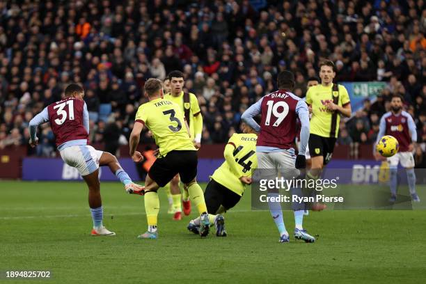 Leon Bailey of Aston Villa scores their team's first goal during the Premier League match between Aston Villa and Burnley FC at Villa Park on...