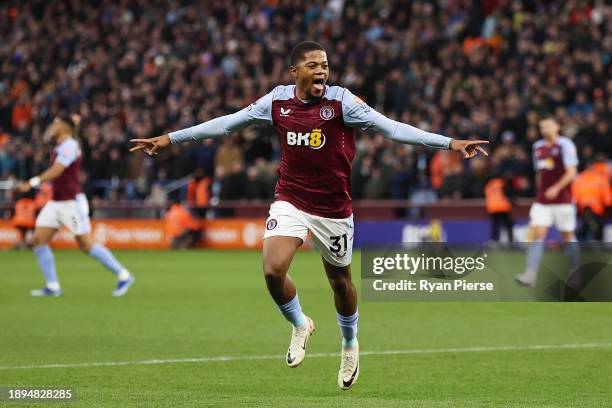 Leon Bailey of Aston Villa celebrates after scoring their team's first goal during the Premier League match between Aston Villa and Burnley FC at...