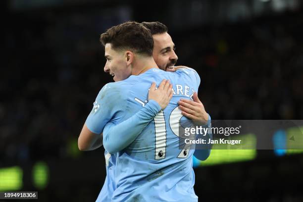 Julian Alvarez of Manchester City celebrates with team mate Bernardo Silva after scoring their sides second goal during the Premier League match...