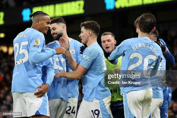 Julian Alvarez of Manchester City celebrates with team mates after scoring their sides second goal during the Premier League match between Manchester...