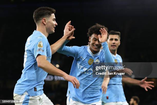 Julian Alvarez of Manchester City celebrates with team mates after scoring their sides second goal during the Premier League match between Manchester...