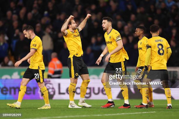 Craig Dawson of Wolverhampton Wanderers celebrates after scoring their sides third goal during the Premier League match between Wolverhampton...