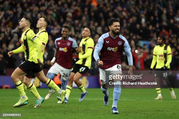 Douglas Luiz of Aston Villa celebrates after scoring their team's third goal from the penalty-spot during the Premier League match between Aston...