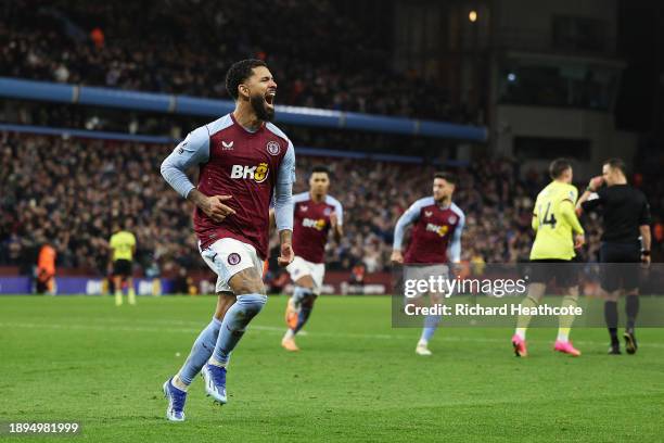 Douglas Luiz of Aston Villa celebrates after scoring their team's third goal from the penalty-spot during the Premier League match between Aston...