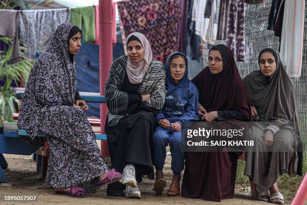 Displaced Palestinians are pictured at the zoo in Rafah in the southern Gaza Strip, on January 2 where they sought refuge amid the ongoing conflict...
