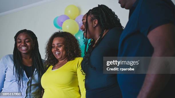 family together at birthday party - milestone stockfoto's en -beelden