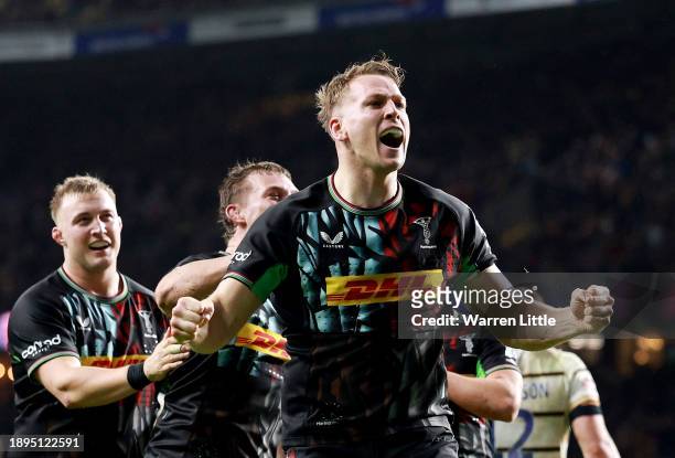 Alex Dombrandt of Harlequins celebrates scoring their team's third try with teammates during the Gallagher Premiership Rugby Big Game 15 match...