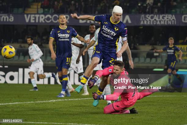 Goalkeeper of US Salernitana, Benoit Costil in action on Pawel Dawidowicz of Hellas Verona during the Serie A TIM match between Hellas Verona FC and...