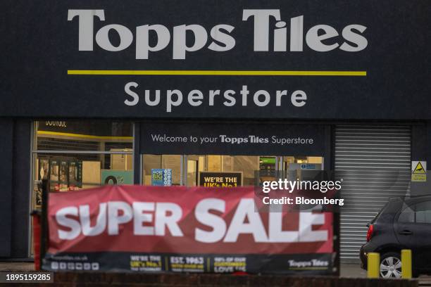 Promotional sales banner outside a Topps Tiles Plc superstore in Romford, UK, on Tuesday, Jan. 2, 2024. Topps Tiles will release a Q1 trading...