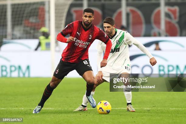 Ruben Loftus-Cheek of AC Milan runs ahead of Domenico Berardi of US Sassuolo during the Serie A TIM match between AC Milan and US Sassuolo at Stadio...