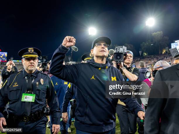 Michigan Wolverines head coach Jim Harbaugh leaves the field after beating Alabama in the Semi-Finals at the Rose Bowl on January 1, 2024 in...