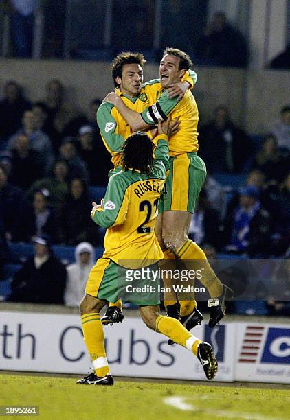 Malky Mackay of Norwich City celebrates with team-mates after scoring the first goal during the Nationwide League Division One match between Millwall...