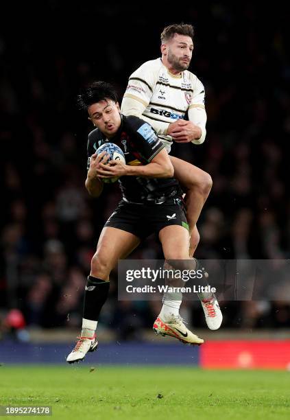 Marcus Smith of Harlequins contends for the aerial ball with Jonny May of Gloucester Rugby during the Gallagher Premiership Rugby Big Game 15 match...