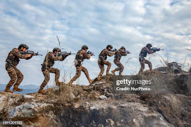 Armed police special forces officers are conducting a tactical search in Hezhou, China, on January 2, 2024.