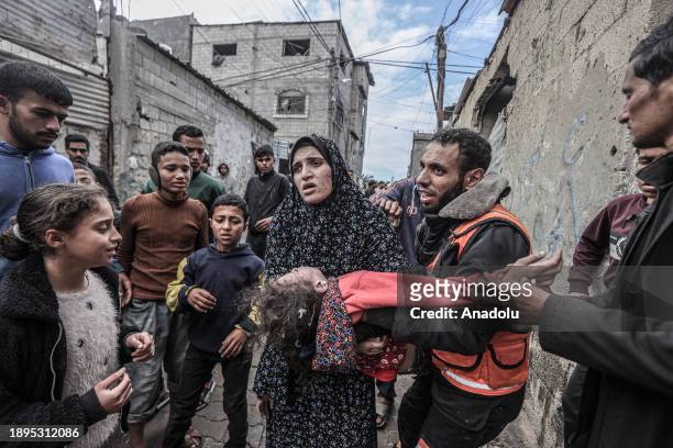 Palestinian mother Al Rus mourns for her daughter, died following the Israeli attack hit the house belonging to the Abu Al-Rus family in Deir Al...