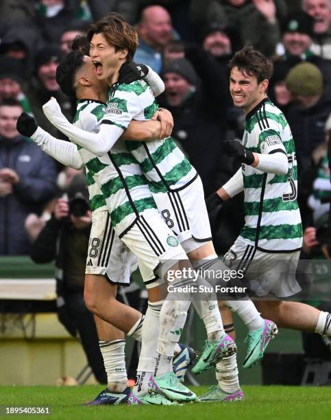 Kyogo Furuhashi of Celtic celebrates with team mates after scoring their team's second goal during the Cinch Scottish Premiership match between...