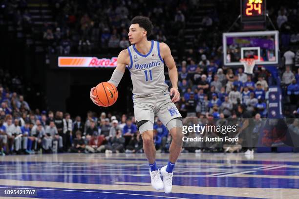 Jahvon Quinerly of the Memphis Tigers handles the ball during the game against the Vanderbilt Commodores at FedExForum on December 23, 2023 in...