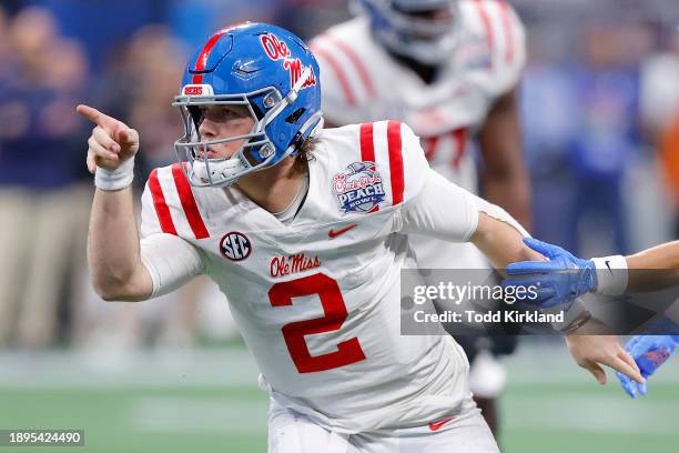 Jaxson Dart of the Mississippi Rebels celebrates a first down against the Penn State Nittany Lions during the fourth quarter in the Chick-fil-A Peach...