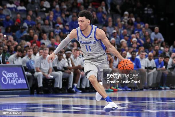 Jahvon Quinerly of the Memphis Tigers handles the ball during the game against the Vanderbilt Commodores at FedExForum on December 23, 2023 in...