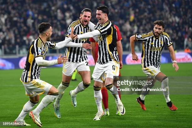 Adrien Rabiot of Juventus celebrates with team mates Filip Kostic and Dusan Vlahovic after scoring their sides first goal during the Serie A TIM...
