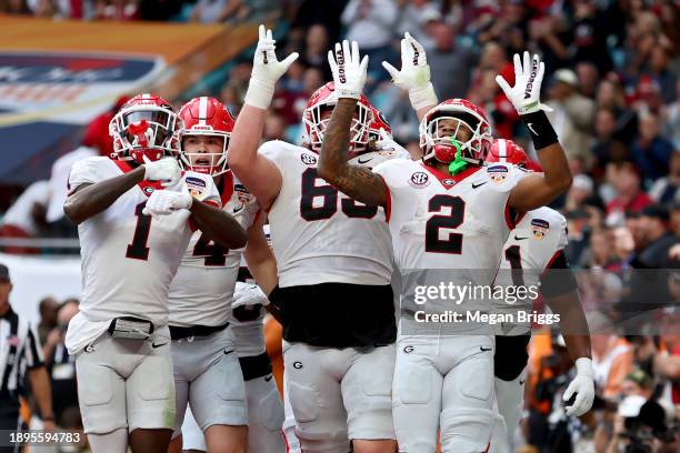 Kendall Milton of the Georgia Bulldogs celebrates with teammates after scoring a touchdown in the second quarter against the Florida State Seminoles...