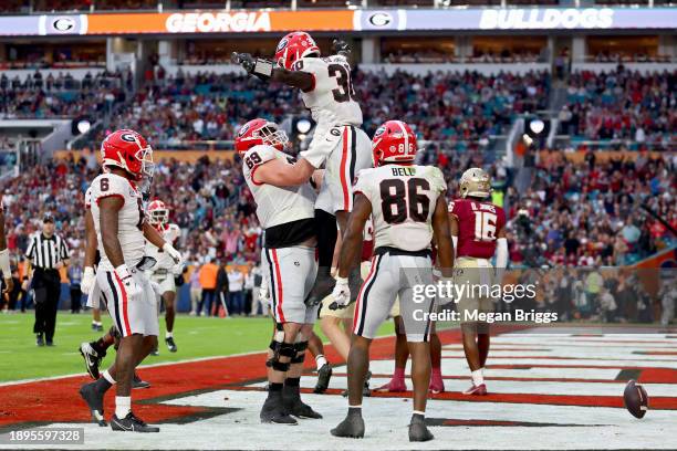 Daijun Edwards of the Georgia Bulldogs celebrates with teammates after scoring a touchdown in the second quarter against the Florida State Seminoles...