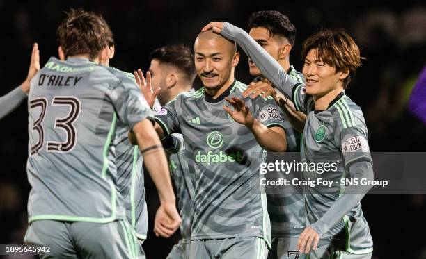 Celtic's Daizen Maeda celebrates with Matt O'Riley after scoring to make it 1-0 during a cinch Premiership match between St Mirren and Celtic at the...
