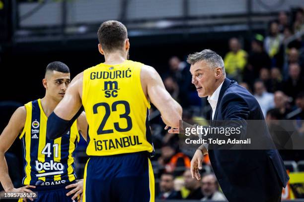 Sarunas Jasikevicius, Head Coach of Fenerbahce Beko Istanbul in action with Marko Guduric, #23 of Fenerbahce Beko Istanbul during the Turkish...