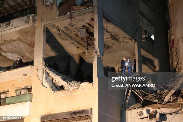 Lebanese emergency responders inspect the site of a strike, reported by Lebanese media to be an Israeli strike targeting a Hamas office, in the...