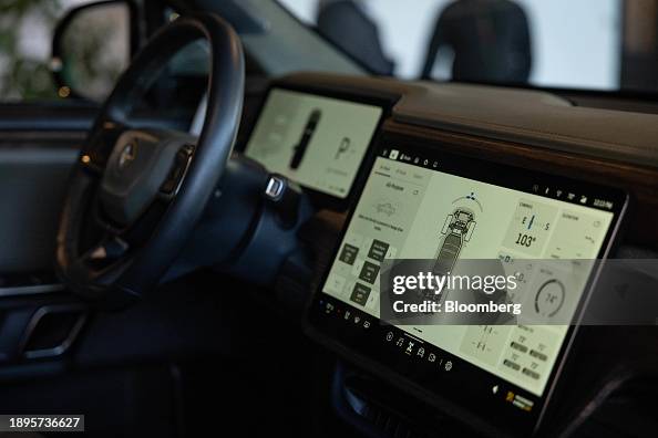Inside Rivain The touchscreen display inside a Rivian R1T electric vehicle pickup ...