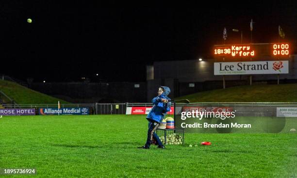 Kerry , Ireland - 2 January 2024; Fionn Molumphy, son of Kerry manager Stephen Molumphy, pucks a few balls as he helps set out the warm up drills...