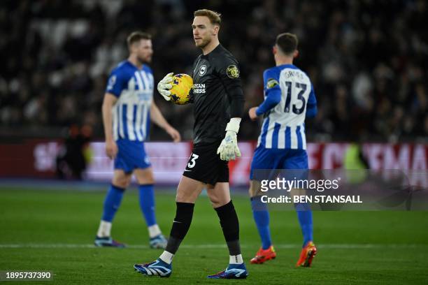 Brighton's English goalkeeper Jason Steele walks with the ball during the English Premier League football match between West Ham United and Brighton...