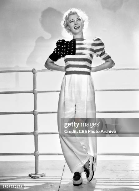 Radio star Penny Singleton, Blondie, wears patriotic sweater. July 1, 1940.