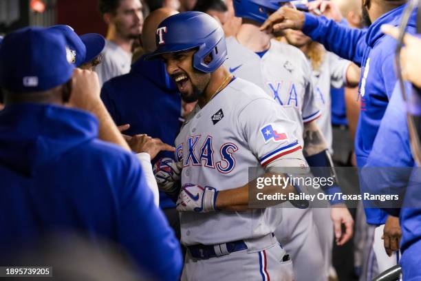 Marcus Semien of the Texas Rangers reacts in the dugout after hitting a three-run home run in the third inning during Game Four of the World Series...