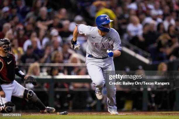 Corey Seager of the Texas Rangers hits a two-run home run in the second inning during Game Four of the World Series against the Arizona Diamondbacks...