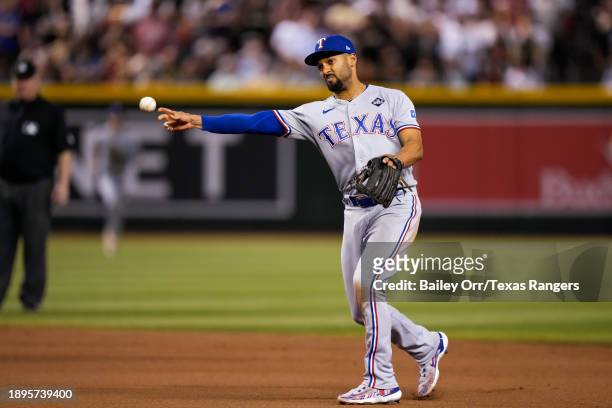 Marcus Semien of the Texas Rangers fields the ball during Game Four of the World Series against the Arizona Diamondbacks at Chase Field on October...