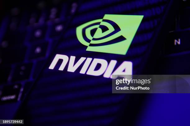 Laptop keyboard, a binary code reflected and Nvidia logo displayed on a phone screen are seen in this illustration photo taken in Krakow, Poland on...