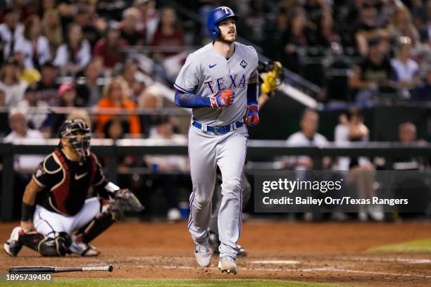 Jonah Heim of the Texas Rangers hits a solo home run in the eighth inning during Game Four of the World Series against the Arizona Diamondbacks at...