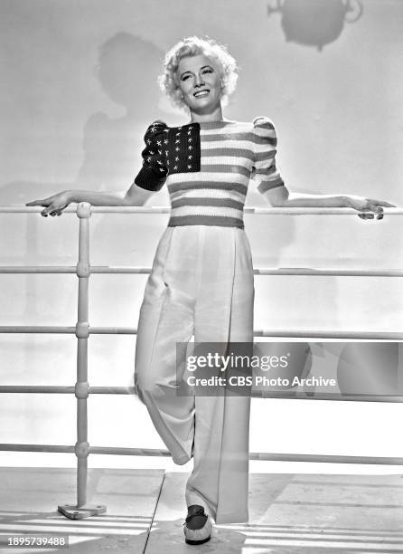 Radio star Penny Singleton, Blondie, wears patriotic sweater. July 1, 1940.