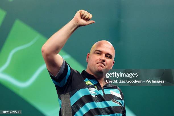 Rob Cross reacts after losing to Luke Littler on day fifteen of the Paddy Power World Darts Championship at Alexandra Palace, London. Picture date:...