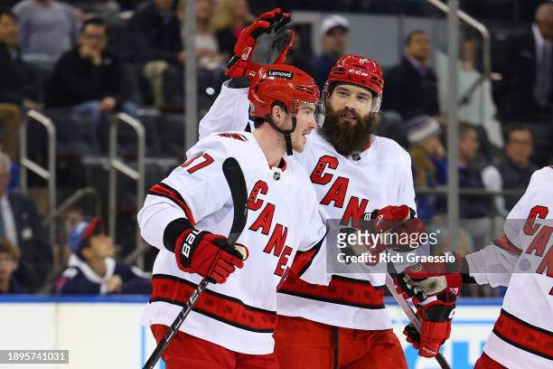 Andrei Svechnikov of the Carolina Hurricanes celebrates with teammates after scoring during the first period of the game against the New York Rangers...