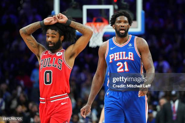 Coby White of the Chicago Bulls and Joel Embiid of the Philadelphia 76ers react in the third quarter at the Wells Fargo Center on January 2, 2024 in...