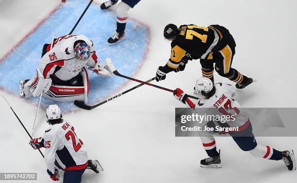 Darcy Kuemper of the Washington Capitals makes a save on a shot by Evgeni Malkin of the Pittsburgh Penguins at PPG PAINTS Arena on January 2, 2023 in...