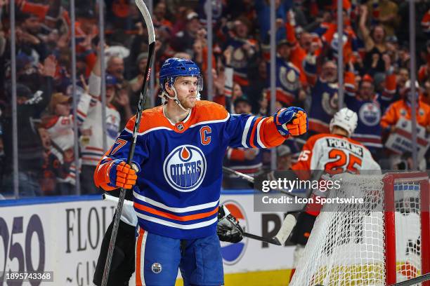 Edmonton Oilers Center Connor McDavid celebrates his goal and 899th point in a night where he reached 900 points in the first period of the Edmonton...