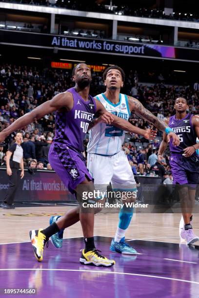 Harrison Barnes of the Sacramento Kings and P.J. Washington of the Charlotte Hornets wait for a rebound during the game on January 2, 2024 at Golden...