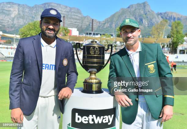 Rohit Sharma of India and Dean Elgar of South Africa with the Freedom Trophy during day 1 of the 2nd Test match between South Africa and India at...